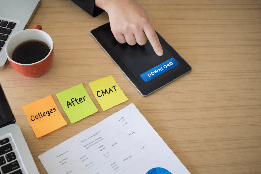 Top-view desk scene with a tablet showing a download button and three sticky notes reading “Colleges,” “After,” and “CMAT,” illustrating options and guidance on what to do after CMAT result.